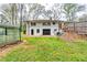 Spacious backyard with a vintage metal shed and a wooden fence offering privacy at 1714 Highland Pl, Decatur, GA 30035