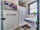 Classic bathroom with tiled walls, framed art, and vintage-style sink at 1714 Highland Pl, Decatur, GA 30035