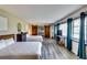 Spacious bedroom with two beds, barn doors, and natural light at 1714 Highland Pl, Decatur, GA 30035