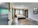 Cozy bedroom with metal bed frame, neutral tones, and natural light at 1714 Highland Pl, Decatur, GA 30035