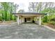 Spacious carport with concrete flooring and brick columns, providing ample parking space at 1714 Highland Pl, Decatur, GA 30035