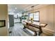 Eat-in kitchen boasts stainless steel appliances, modern lighting and a custom table at 1714 Highland Pl, Decatur, GA 30035