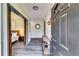 Bright entryway with wood-look floors and a view of the bedroom through a barn door at 1714 Highland Pl, Decatur, GA 30035