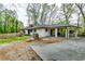 Charming single-story home with a covered carport and a well-maintained exterior at 1714 Highland Pl, Decatur, GA 30035