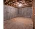 Unfinished basement with concrete walls and floor, offering a blank canvas for a new owner at 5101 Barrington Trace Dr, Atlanta, GA 30331