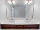 Bathroom with double sinks, modern lighting, and a neutral color palette at 5101 Barrington Trace Dr, Atlanta, GA 30331