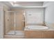 Spa-like bathroom with a glass-enclosed shower and a luxurious soaking tub at 5101 Barrington Trace Dr, Atlanta, GA 30331