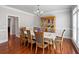 Formal dining room featuring hardwood floors, classic molding, and a large window for natural light at 5101 Barrington Trace Dr, Atlanta, GA 30331