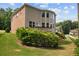 A lush lawn surrounds the back of this home, featuring a walkout deck and mature landscaping at 5101 Barrington Trace Dr, Atlanta, GA 30331