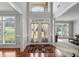 Elegant foyer with hardwood floors, high ceilings, and a view into the living space at 5101 Barrington Trace Dr, Atlanta, GA 30331