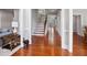Spacious hallway with hardwood floors, white trim, and staircase in view at 5101 Barrington Trace Dr, Atlanta, GA 30331