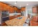 Modern kitchen with granite countertops, stainless steel appliances, and a large island at 5101 Barrington Trace Dr, Atlanta, GA 30331
