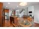 Kitchen and breakfast nook with granite island, wood cabinets, stainless steel appliances, and hardwood floors at 5101 Barrington Trace Dr, Atlanta, GA 30331