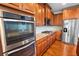 Updated kitchen with wood cabinets, stainless steel appliances, and granite countertops at 5101 Barrington Trace Dr, Atlanta, GA 30331