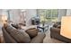 Bright living room with large windows, neutral carpet, and comfortable seating area at 5101 Barrington Trace Dr, Atlanta, GA 30331