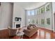 Bright living room boasting a fireplace, hardwood floors, and many large windows with lots of natural light at 5101 Barrington Trace Dr, Atlanta, GA 30331