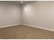 Carpeted bedroom with a neutral palette and ample natural light at 1282 Ainsworth Aly, Sugar Hill, GA 30518