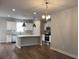 Bright kitchen with stainless steel appliances, white cabinets, and large island at 1282 Ainsworth Aly, Sugar Hill, GA 30518