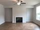Spacious living room features a modern fireplace, hardwood floors, and neutral paint at 1282 Ainsworth Aly, Sugar Hill, GA 30518