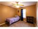 Cozy bedroom features a bed, storage cabinet, and natural light at 20 Riverbrooke Rd, Covington, GA 30016