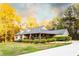 Charming home featuring a welcoming front porch and well-manicured landscaping and a flowing driveway at 20 Riverbrooke Rd, Covington, GA 30016