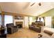 Cozy living room with stone fireplace, comfortable seating, and abundant natural light at 20 Riverbrooke Rd, Covington, GA 30016