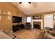 Comfortable living room featuring a stone fireplace and ample seating for relaxation at 20 Riverbrooke Rd, Covington, GA 30016