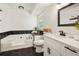 Modern bathroom featuring a bathtub, vanity, and black-and-white tile at 320 Creek Side Ct, Mcdonough, GA 30252