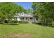 Attractive one-story home with a covered porch and spacious front yard at 320 Creek Side Ct, Mcdonough, GA 30252
