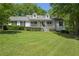 Charming one-story home with a covered front porch and well-manicured lawn at 320 Creek Side Ct, Mcdonough, GA 30252