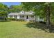 Beautiful single-story home featuring a covered porch and lush green front yard at 320 Creek Side Ct, Mcdonough, GA 30252