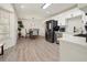 Kitchen dining area features stainless appliances, pendant lighting, with seamless flow at 320 Creek Side Ct, Mcdonough, GA 30252
