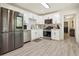 Modern kitchen features stainless steel appliances, white cabinets and subway tile backsplash at 320 Creek Side Ct, Mcdonough, GA 30252