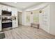 Bright eat-in kitchen with a built-in seating area by large windows overlooking yard at 320 Creek Side Ct, Mcdonough, GA 30252