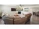 Comfortable living room featuring a stone fireplace, TV, and cozy seating area at 320 Creek Side Ct, Mcdonough, GA 30252