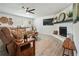 Cozy living room featuring a fireplace and comfortable reclining couch at 320 Creek Side Ct, Mcdonough, GA 30252