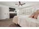 Bedroom boasts a television, bay window, and ensuite bathroom for convenience at 320 Creek Side Ct, Mcdonough, GA 30252