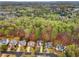 Neighborhood aerial shot showing house nestled in a community with green trees and lawns at 4847 Sara Creek Way, Sugar Hill, GA 30518
