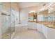 Luxurious bathroom featuring a glass-enclosed shower, soaking tub, and granite countertops at 4847 Sara Creek Way, Sugar Hill, GA 30518