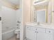 Bathroom with combination shower/tub and a vanity with white cabinets at 4847 Sara Creek Way, Sugar Hill, GA 30518