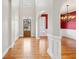Inviting foyer with gleaming hardwood floors, arched entryway, and natural light flowing throughout at 4847 Sara Creek Way, Sugar Hill, GA 30518