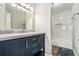 Bathroom with marble countertop vanity, modern fixtures, and tub with white subway tile surround at 508 Cumberland Se Ct, Smyrna, GA 30080