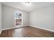 Bright bedroom featuring wood-look floors and a window with natural light at 508 Cumberland Se Ct, Smyrna, GA 30080