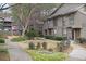 Charming townhome community showcasing manicured lawns, lush landscaping and a sidewalk to front door at 508 Cumberland Se Ct, Smyrna, GA 30080