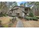 Two story townhome with covered back porch, lush greenery, sidewalks, and a beautifully landscaped yard at 508 Cumberland Se Ct, Smyrna, GA 30080