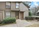 Inviting townhome exterior featuring a well-maintained facade and landscaped front entrance with twin entry doors at 508 Cumberland Se Ct, Smyrna, GA 30080