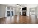 Bright living room with hardwood floors, fireplace, and sliding glass doors to the outdoor balcony at 508 Cumberland Se Ct, Smyrna, GA 30080