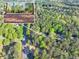 Aerial shot of a beautiful property nestled among lush trees, showcasing its serene and private location at 2701 East Mill Sw Way, Conyers, GA 30094