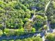 Aerial image showing property boundaries on a large wooded lot of approximately 4.24 acres at 2701 East Mill Sw Way, Conyers, GA 30094
