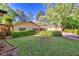 Expansive backyard with well-maintained lawn, privacy hedges, and mature trees for a serene outdoor space at 2701 East Mill Sw Way, Conyers, GA 30094